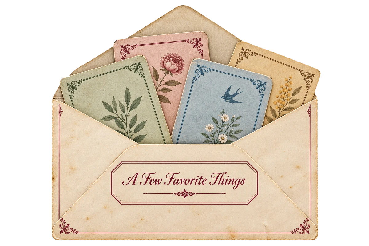 An open cream envelope printed “A Few Favorite Things”, four decorated cards tucked inside