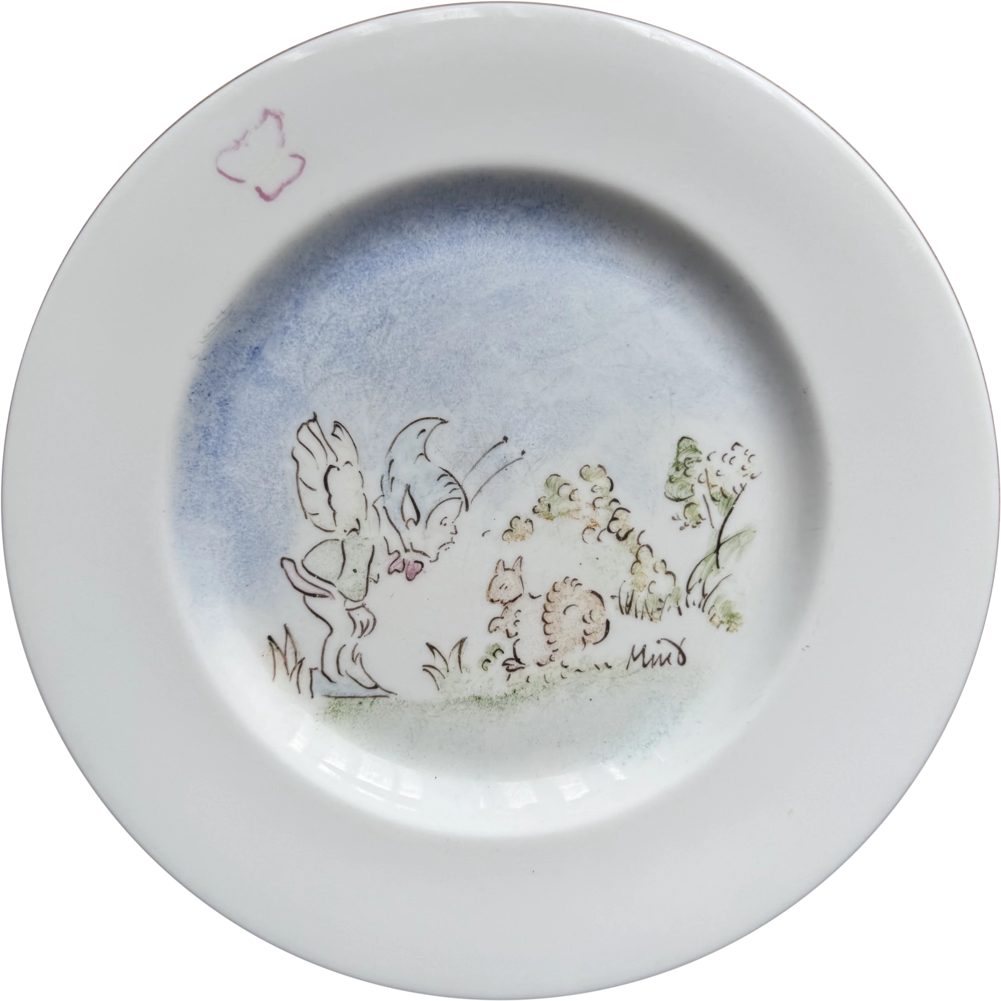 A white ceramic plate I decorated: a winged figure and small animals in a meadow under a blue wash, signed Mint, with a pink butterfly on the rim