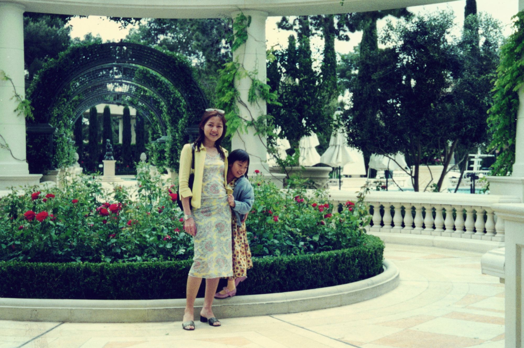 My mother and me in a formal rose garden