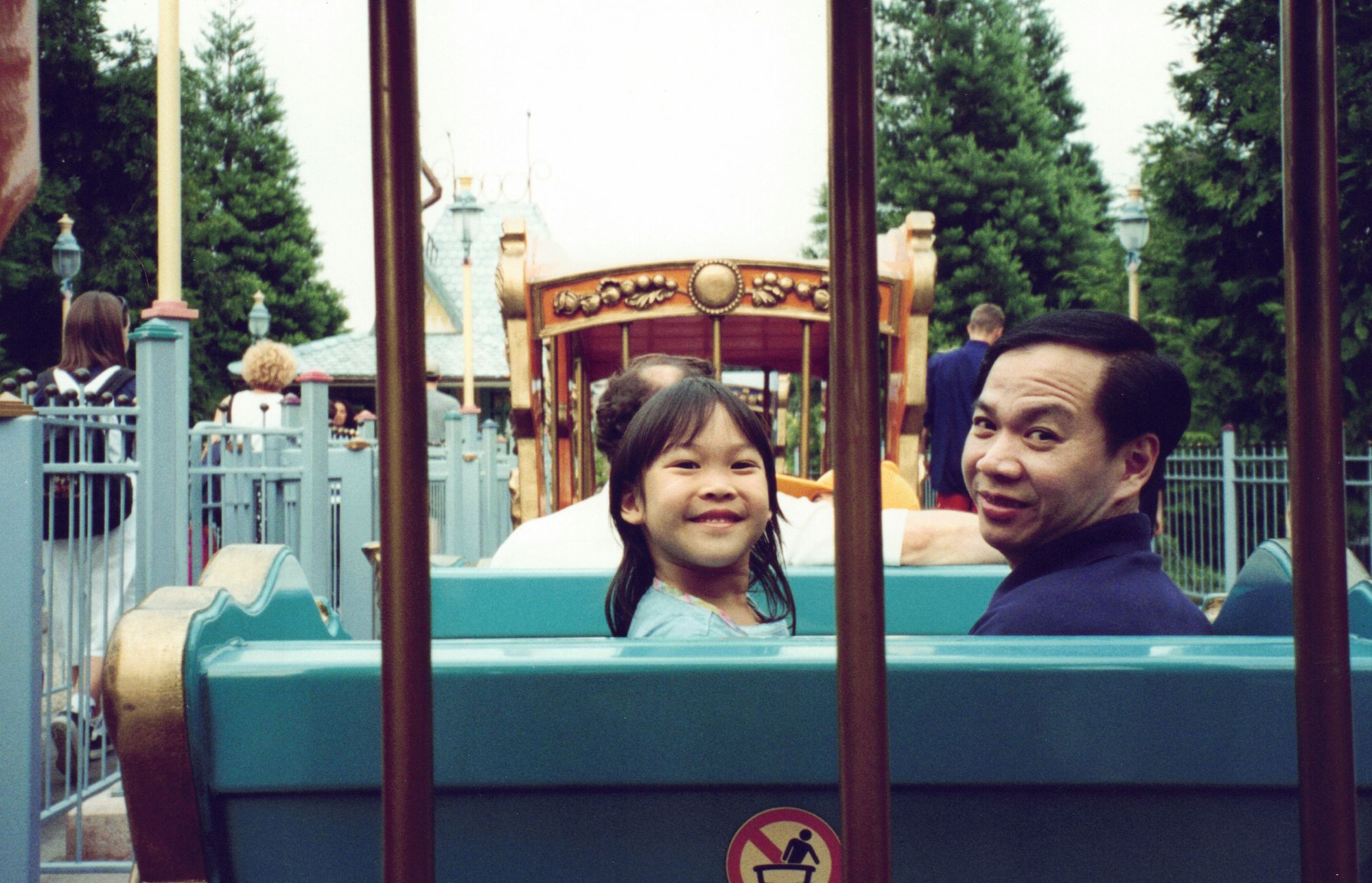 My father and me turned around on an amusement-park ride, both smiling